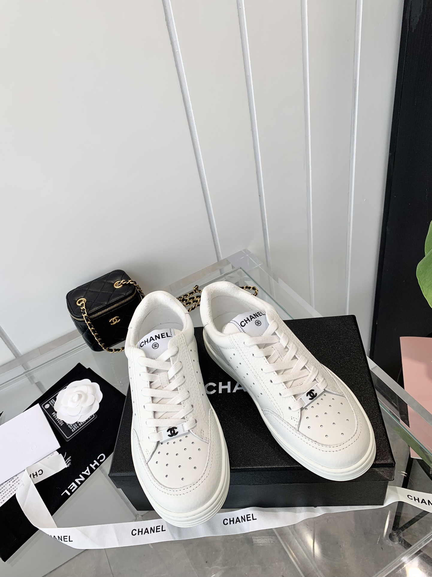 Chanel Embossed Logo Low-Top Sneakers White