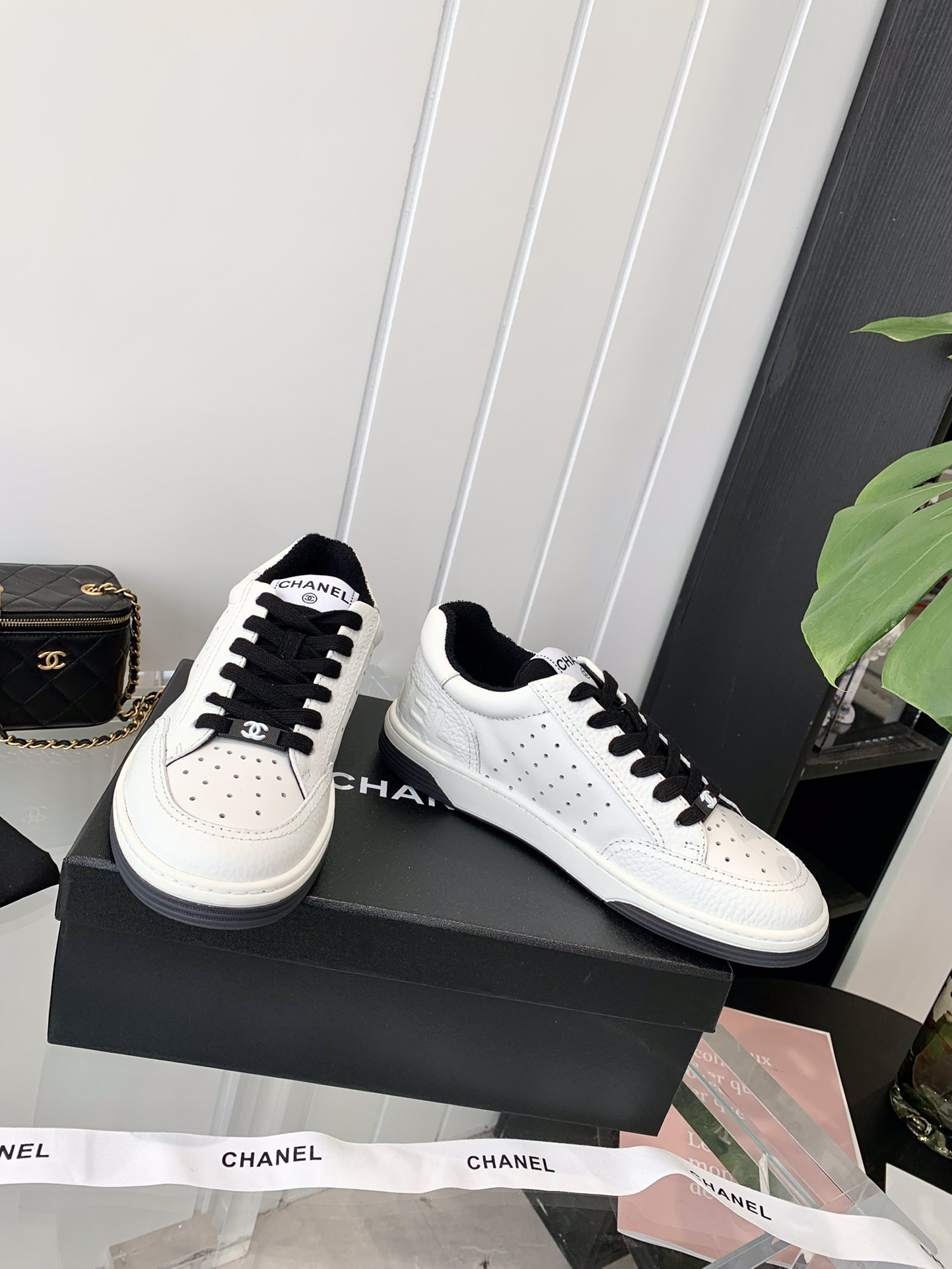 Chanel Embossed Logo Sneakers White/Black