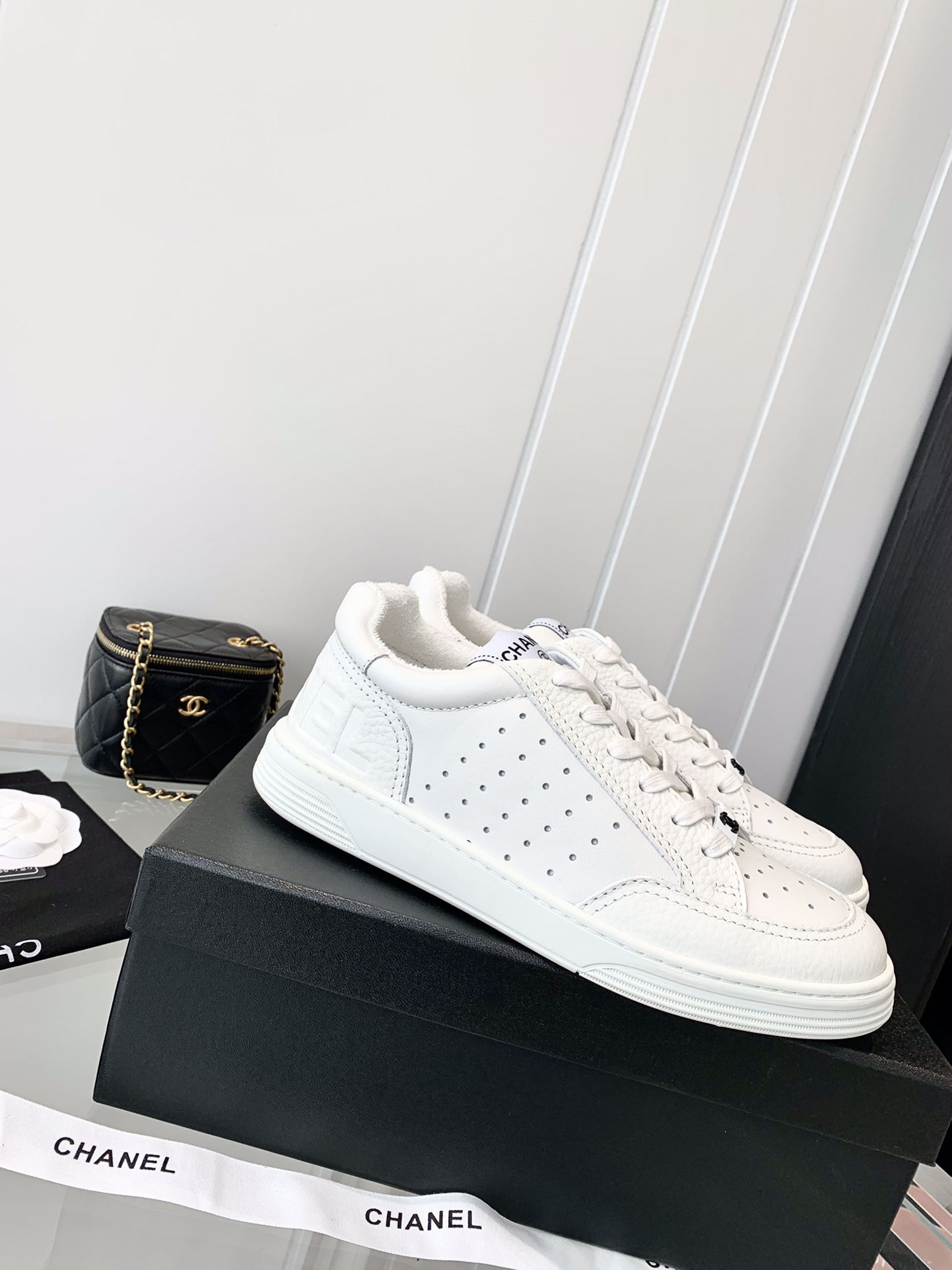 Chanel Embossed Logo Low-Top Sneakers White