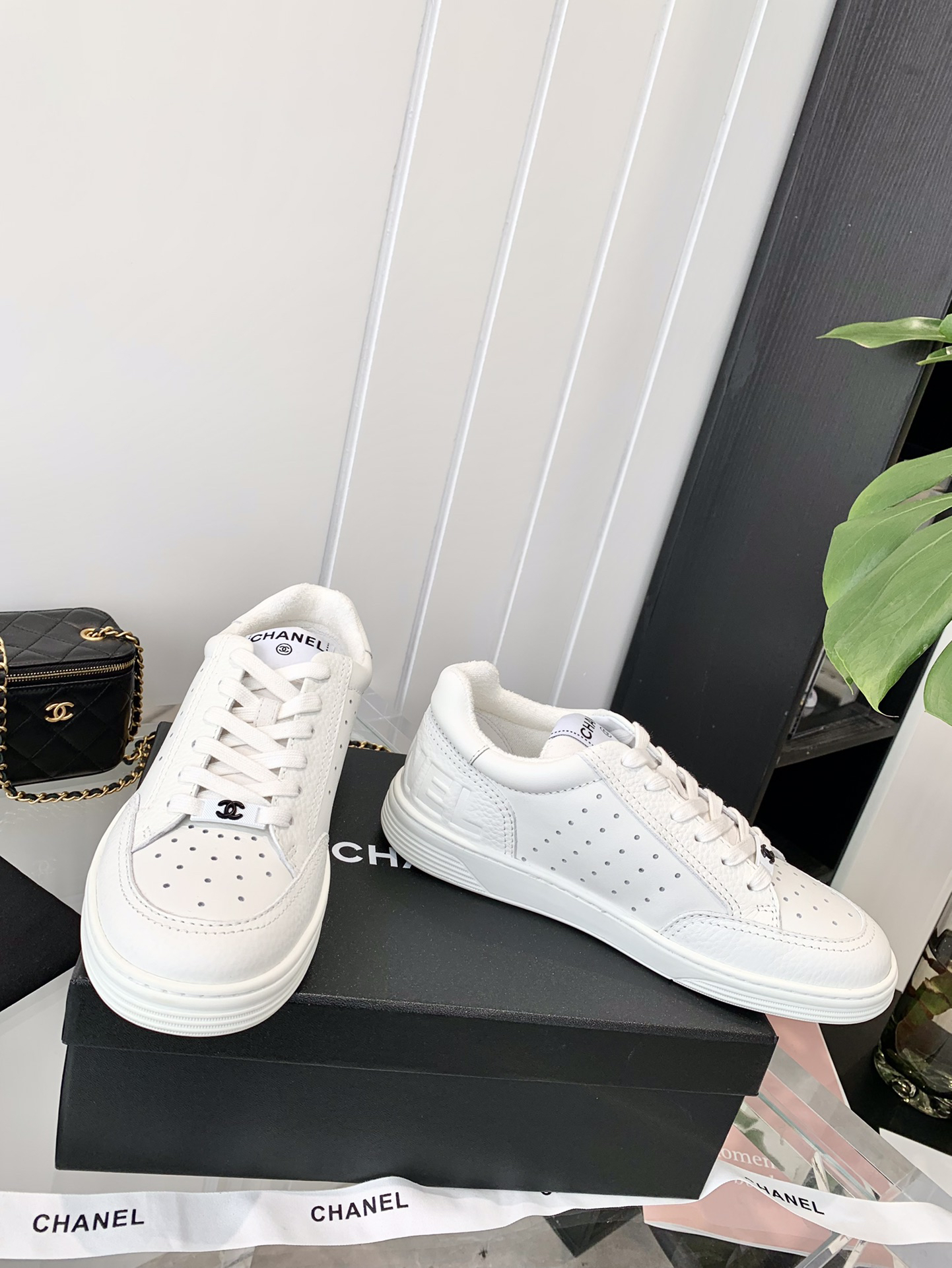 Chanel Embossed Logo Low-Top Sneakers White