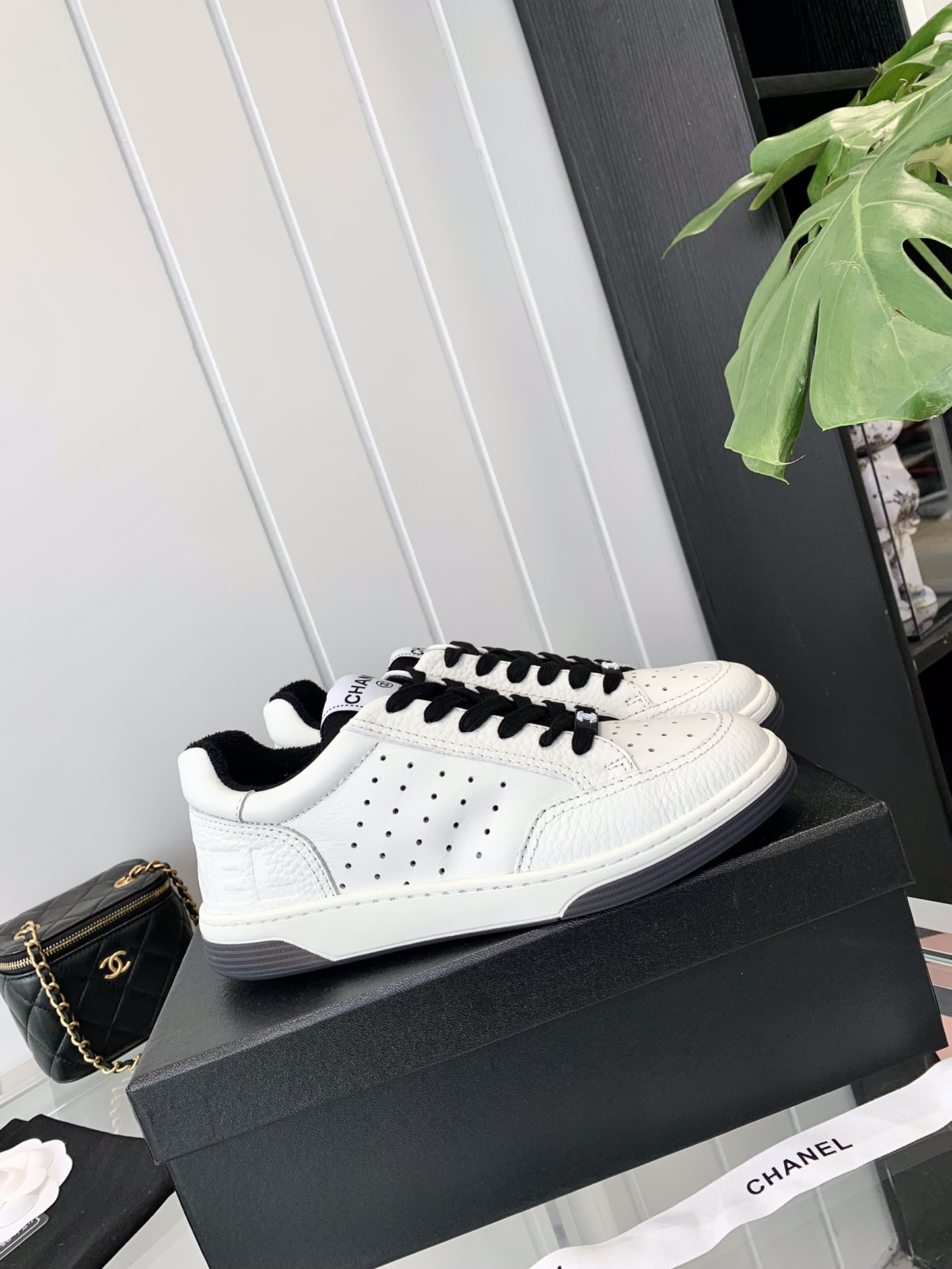Chanel Embossed Logo Sneakers White/Black