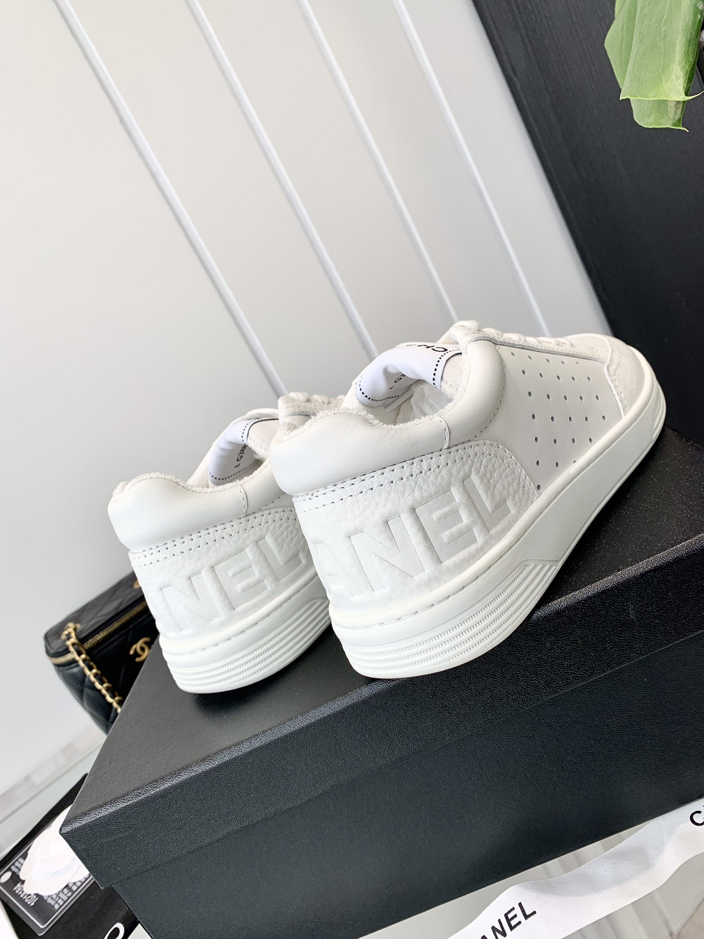Chanel Embossed Logo Low-Top Sneakers White