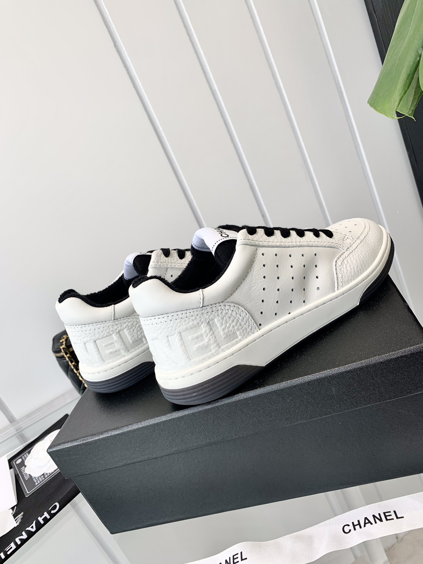Chanel Embossed Logo Sneakers White/Black