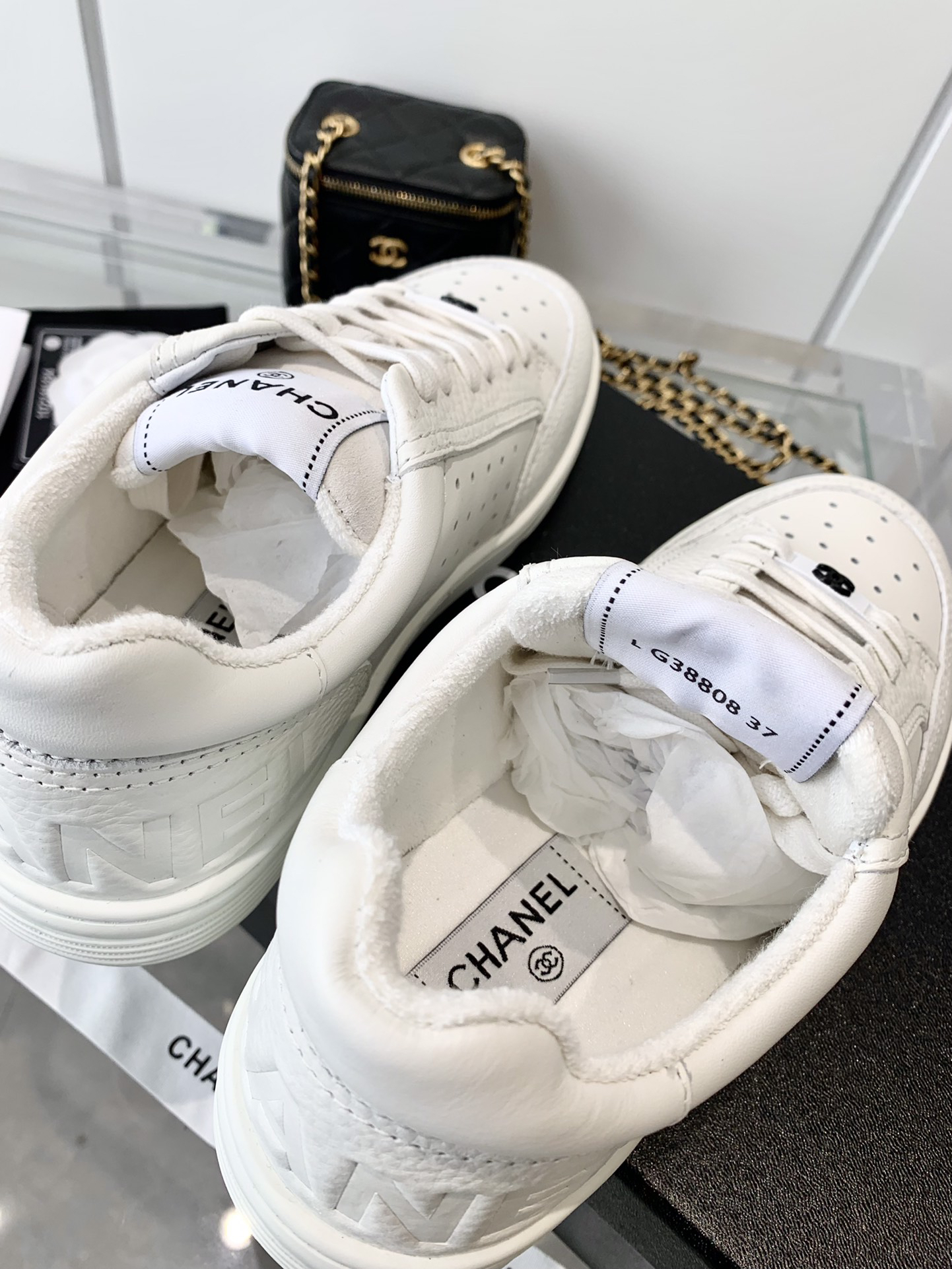 Chanel Embossed Logo Low-Top Sneakers White