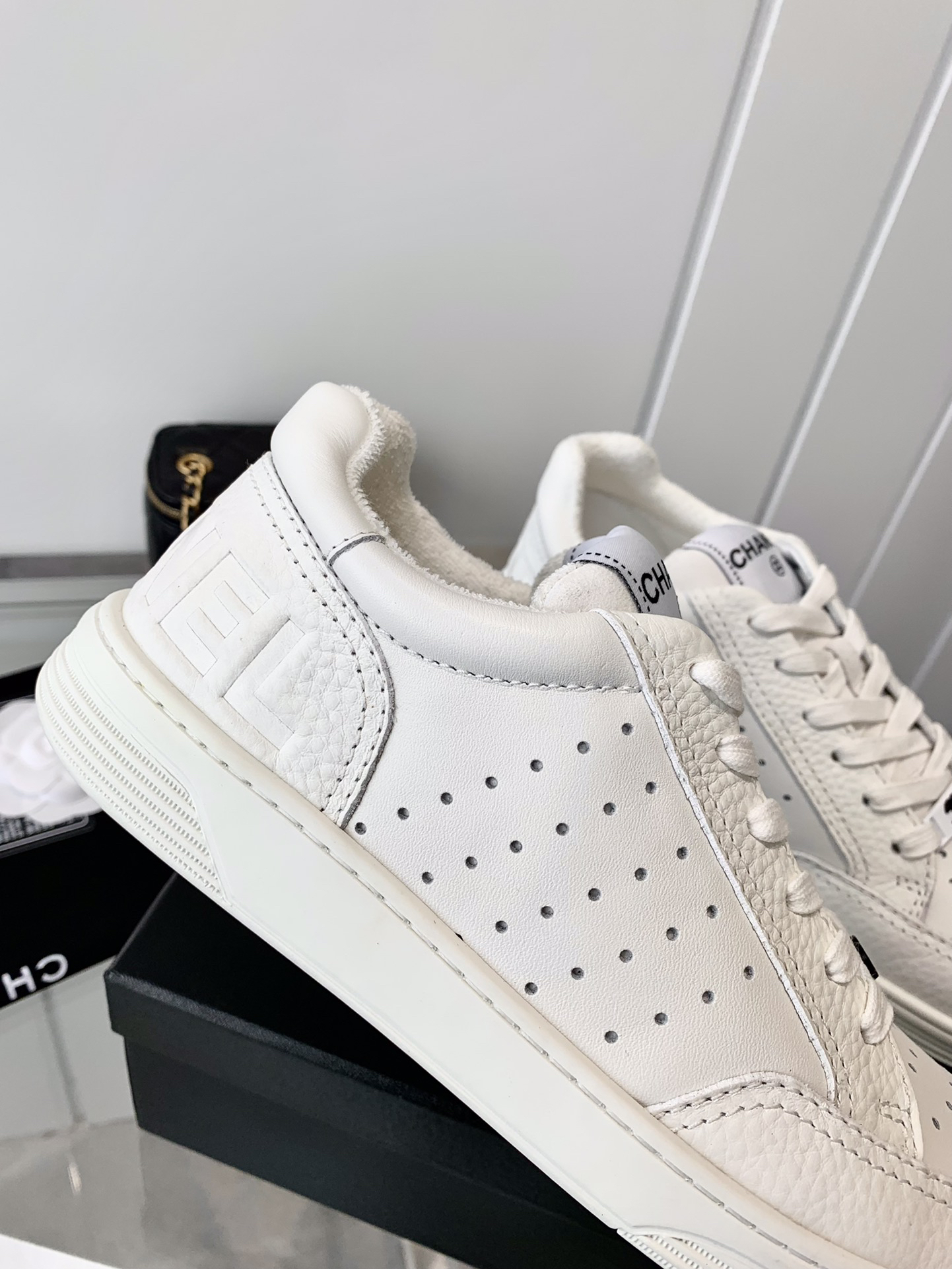 Chanel Embossed Logo Low-Top Sneakers White
