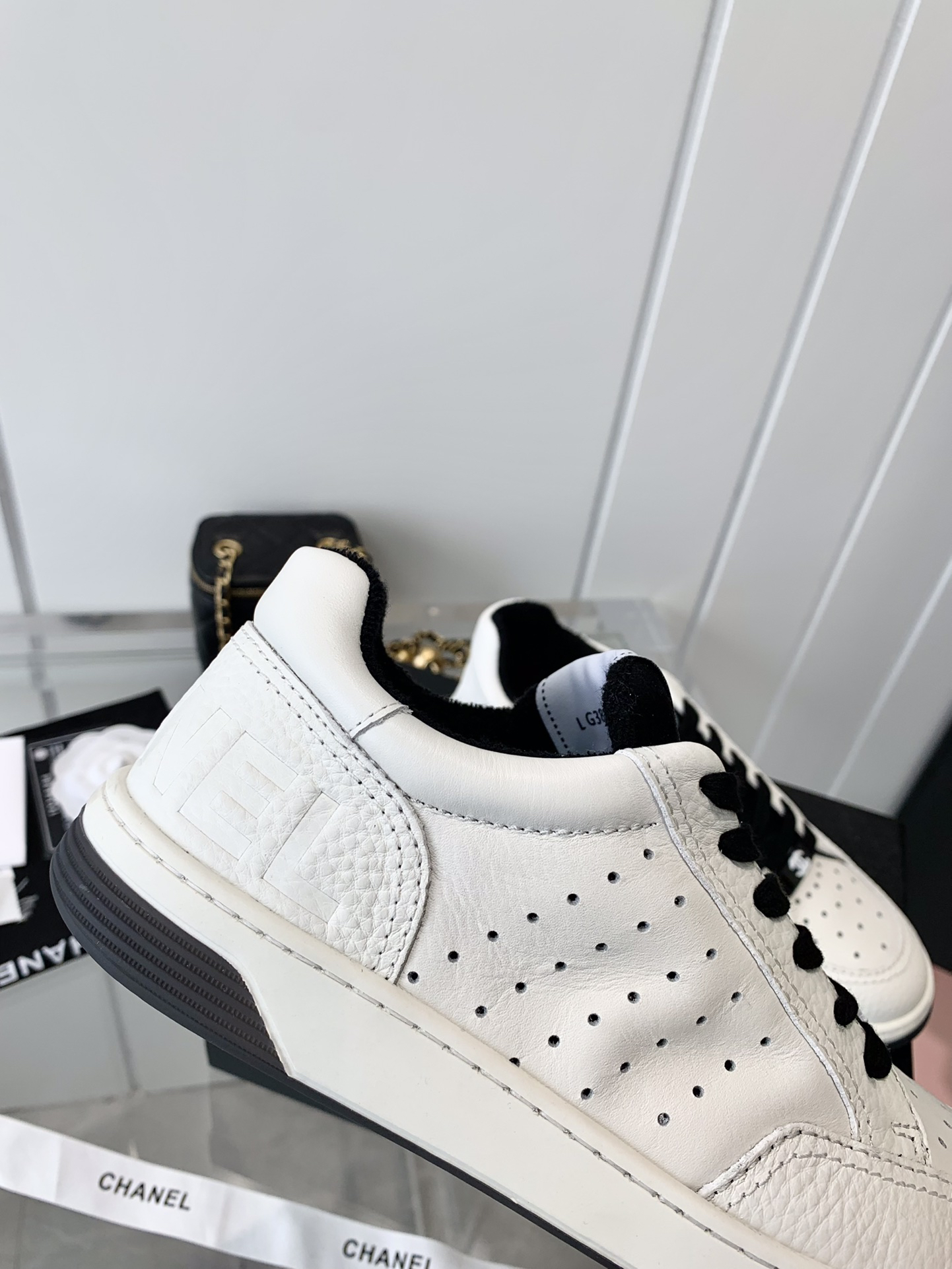 Chanel Embossed Logo Sneakers White/Black
