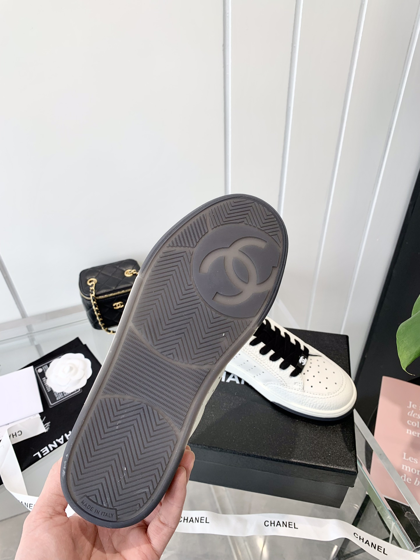 Chanel Embossed Logo Sneakers White/Black