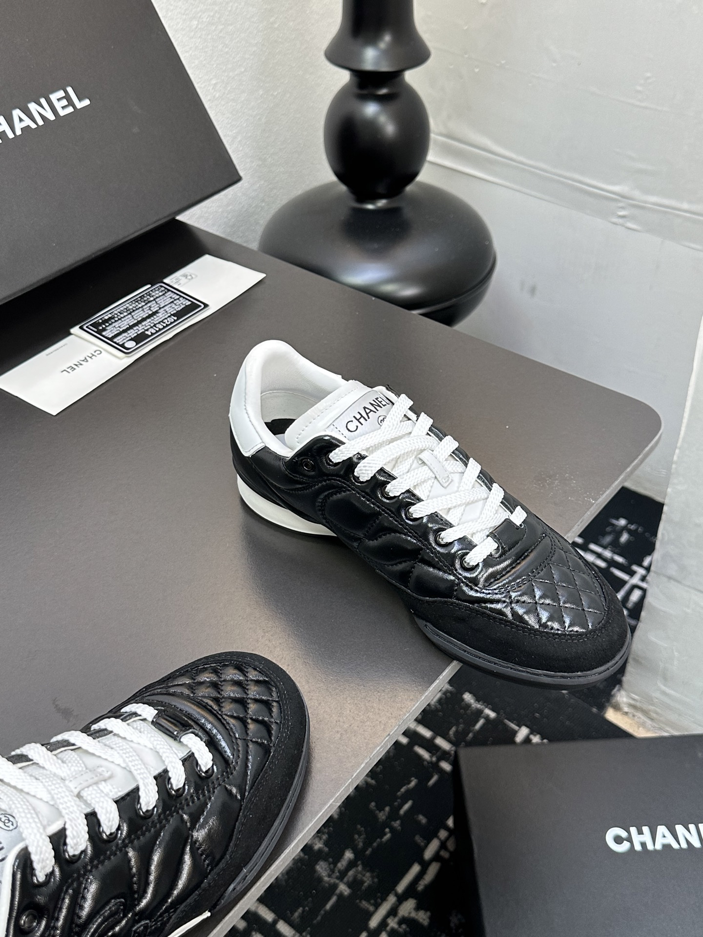 Chanel Quilted Leather Low Sneakers Black/White