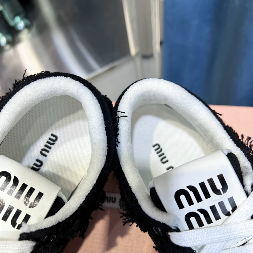 Miu Miu Distressed Fringe Sneakers Black